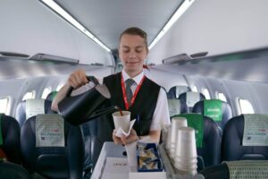 DAT male flight attendant serving