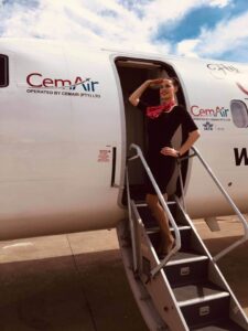 Fly CemAir female flight attendant steps