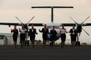 Fly CemAir female flight attendants walk