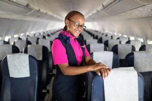 FlySafair female flight attendant boarding