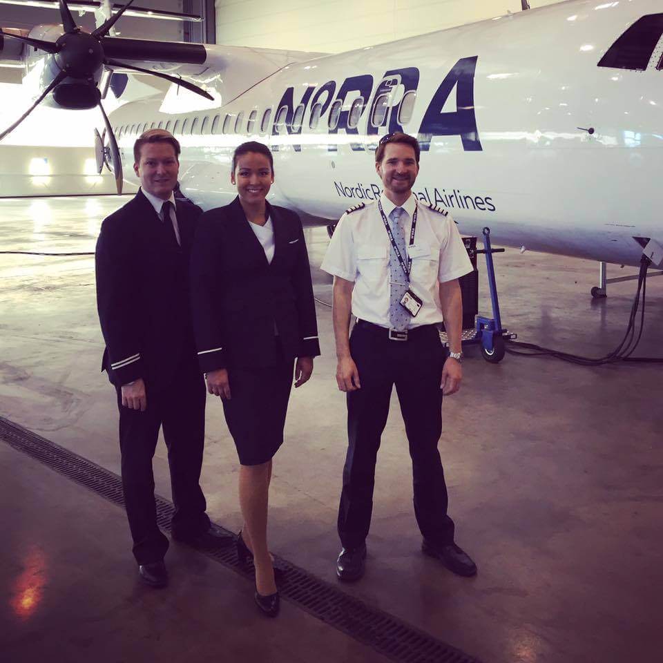 Norra male and female flight attendants hangar