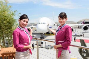 Peach Aviation female cabin crews airplane background