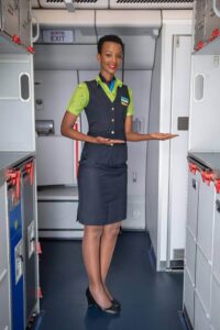 RwandAir female flight attendant galley