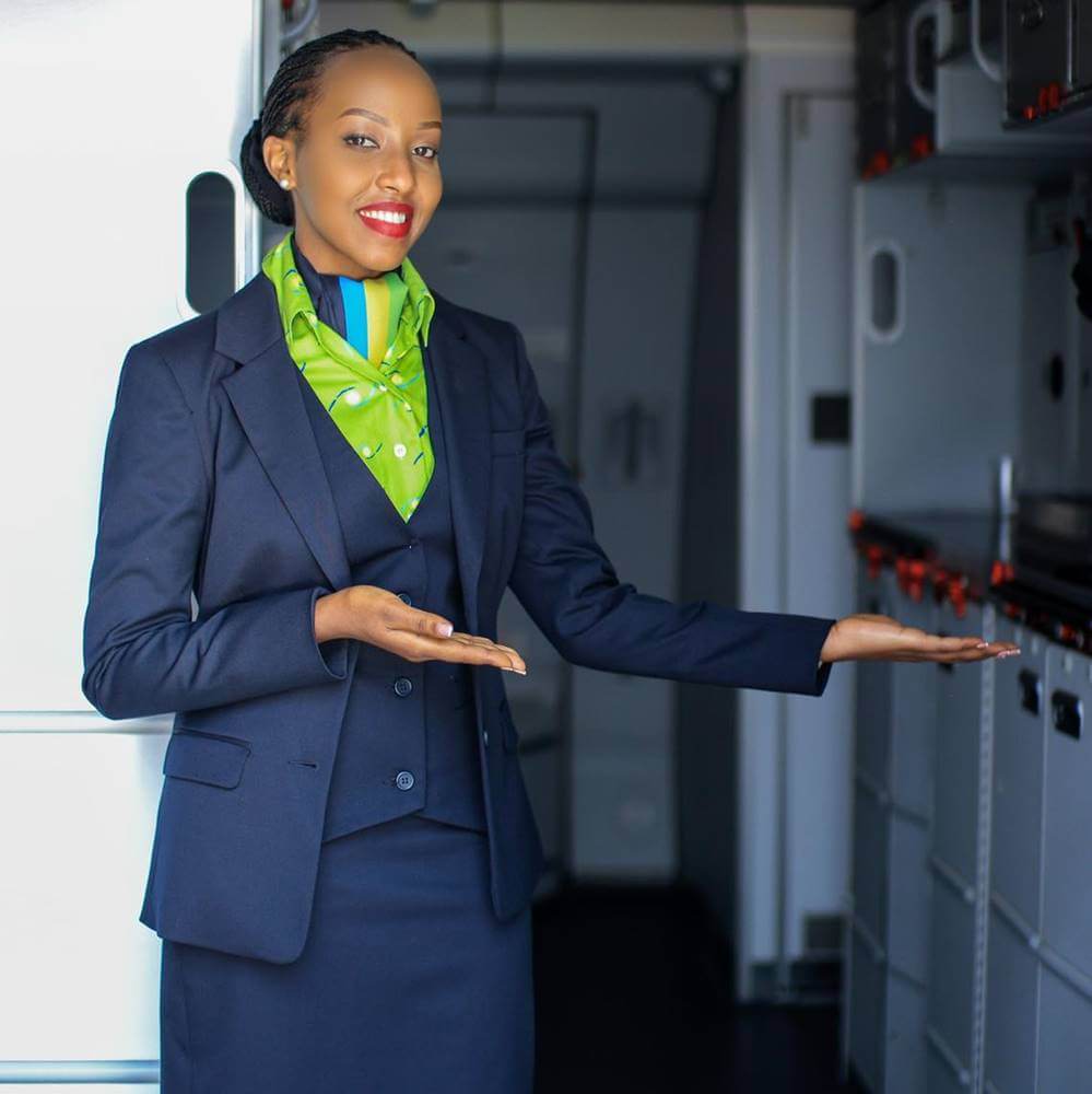 RwandAir female flight attendant welcoming