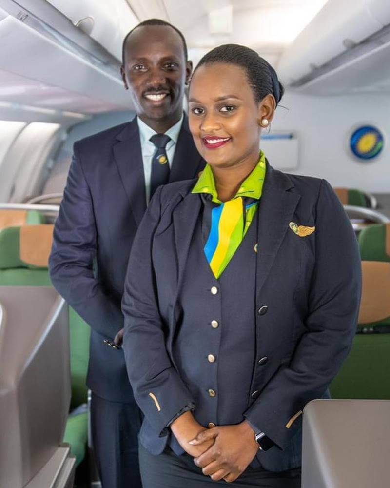 RwandAir male and female flight attendant boarding