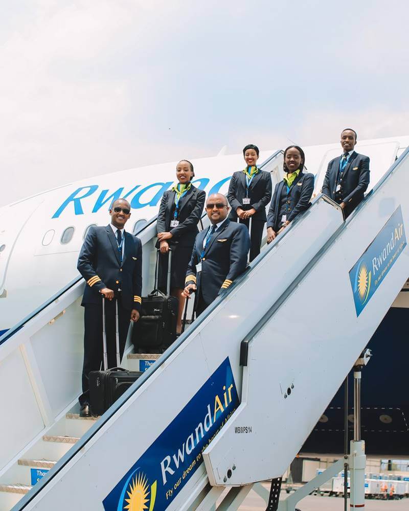 RwandAir male and female flight atttendants steps