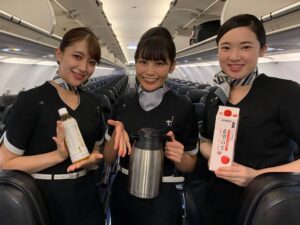 StarFlyer female cabin crews with drinks