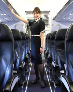 StarFlyer female flight attendant boarding