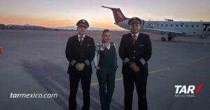 TAR Aerolineas female flight attendant with pilots