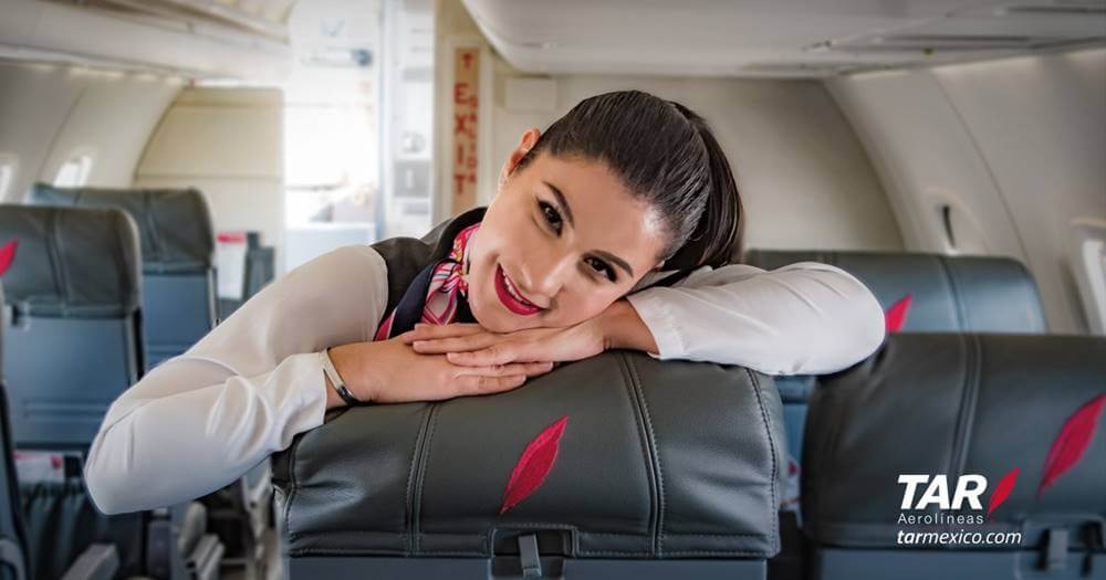 TAR Aerolineas flight attendant ready to board