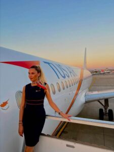 TUS Airways female flight attendant airplane