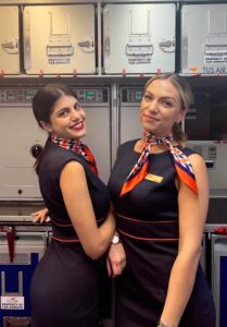 TUS Airways female flight attendants galley