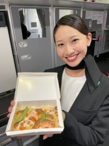 Zipair female flight attendant food box