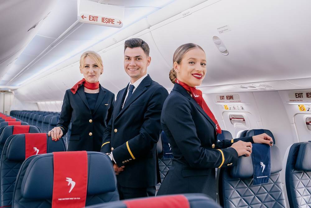 Blue Air flight attendants smile boarding