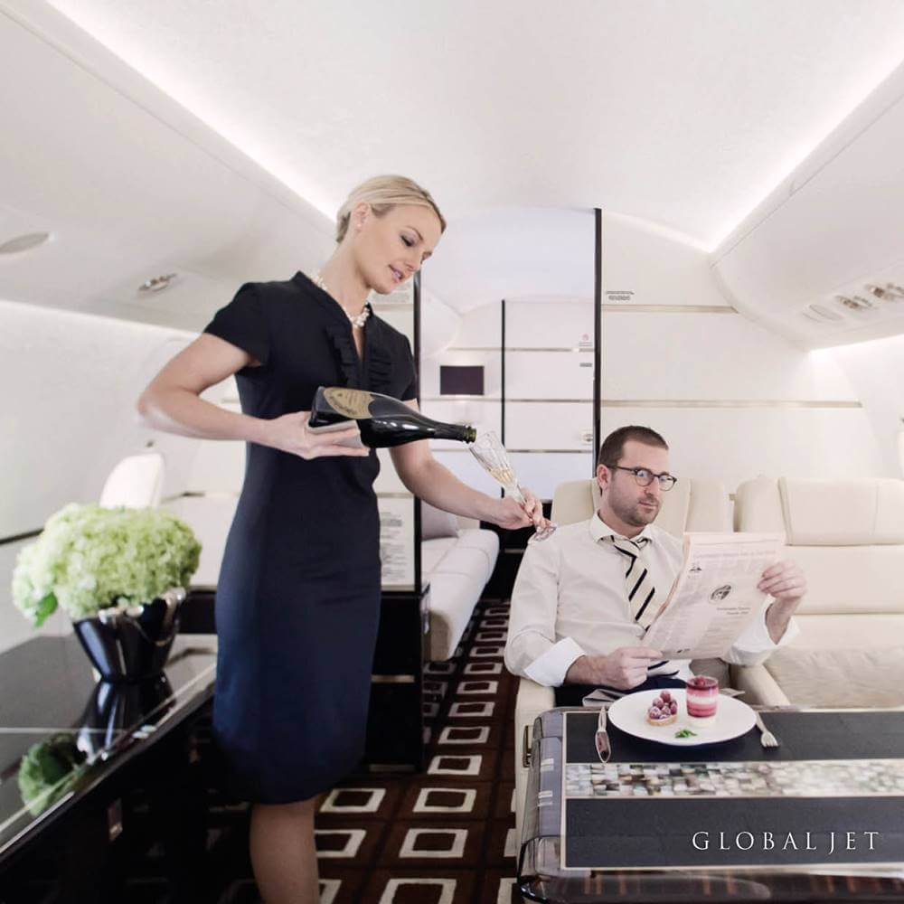Global Jet flight attendant champagne