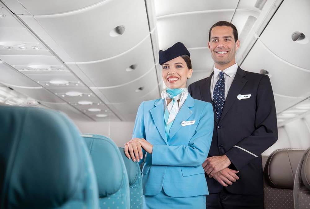 Hi Fly male and female flight attendants boarding