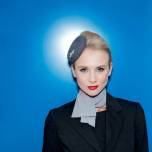 Luxaviation female flight attendant blue eyes