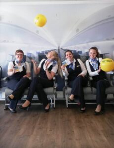 People's Airline flight attendants happy balloons