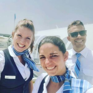 People's Airline male and female flight attendant happy