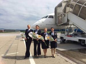 People's Airline pilot and flight attendants flowers