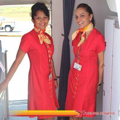 Surinam Airways female flight attendant boarding