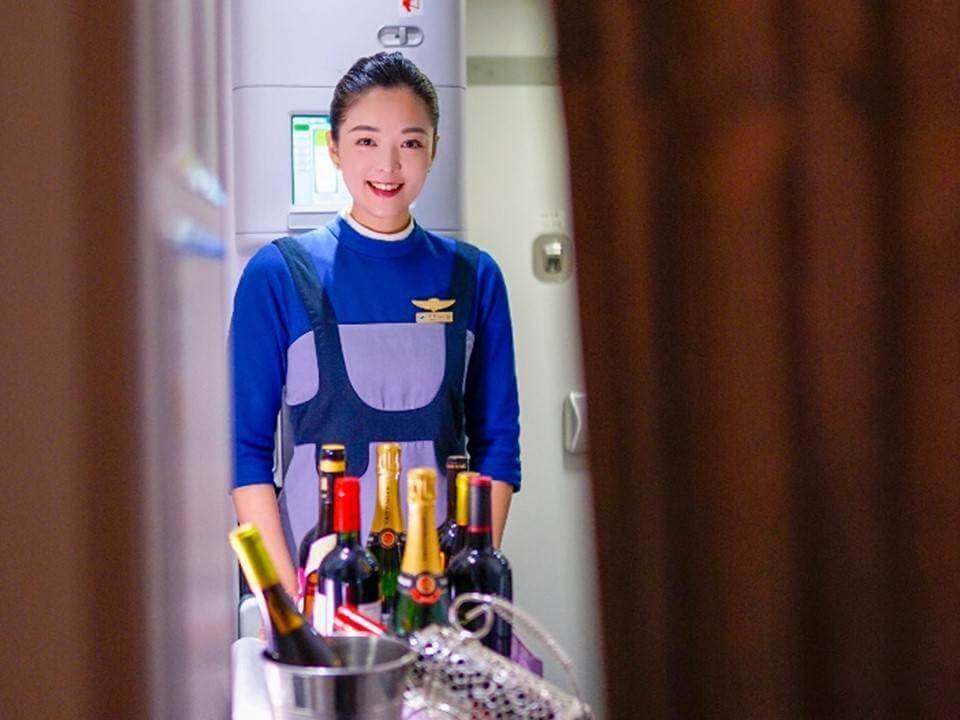 Xiamen Airlines flight attendant drinks cart