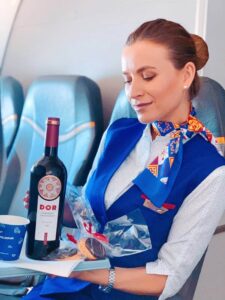 Air Moldova flight attendant wine service