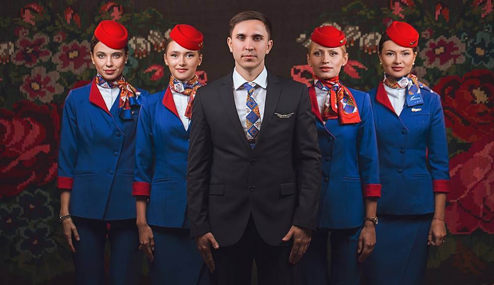 Air Moldova male and female flight attendants pose