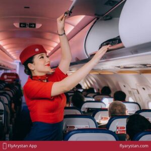 FlyArystan flight attendant hatrack