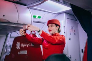 FlyArystan flight attendant safety demo