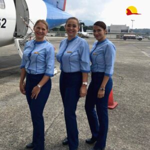 Satena female flight attendants tarmac