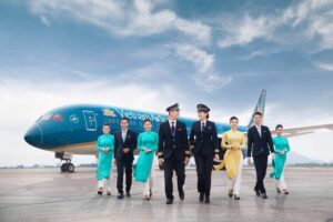Vietnam Airlines pilots and cabin crew walk tarmac