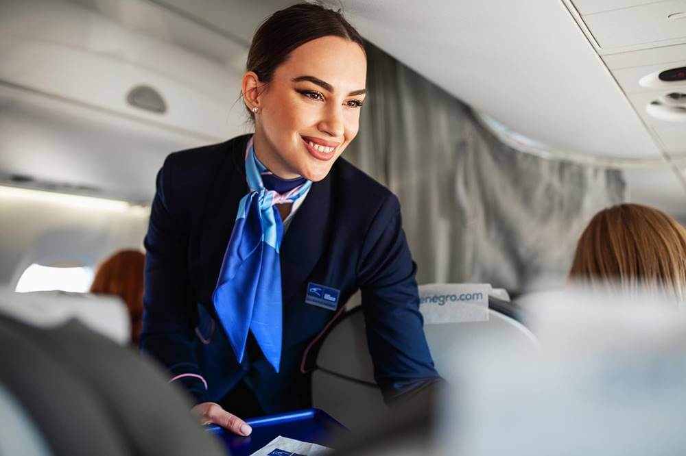 Air Montenegro flight attendant smile