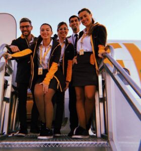 Flybondi flight attendants and pilot steps