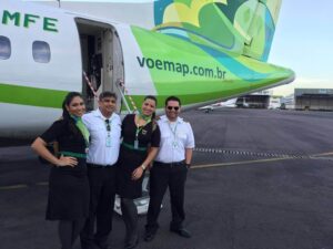 MAP Linhas Aereas cabin crews and pilots smile