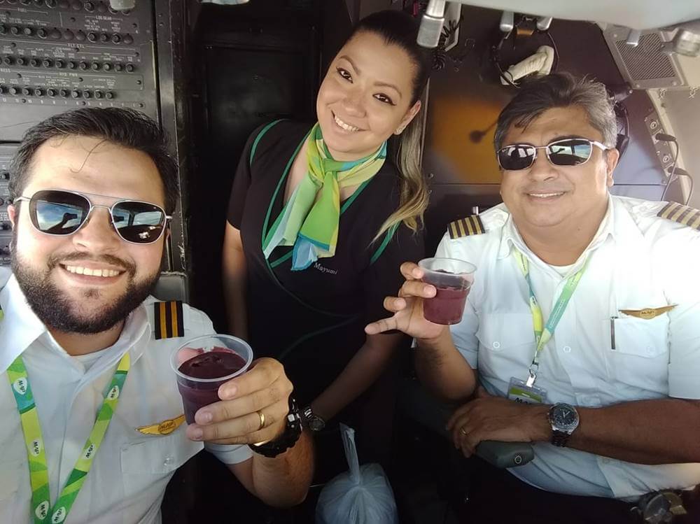 MAP Linhas Aereas flight attendant and pilot cockpit