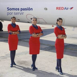 Red Air flight attendants pose tarmac
