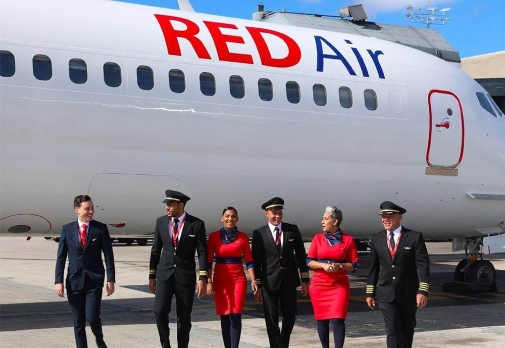 Red Air pilots and flight attendants walk