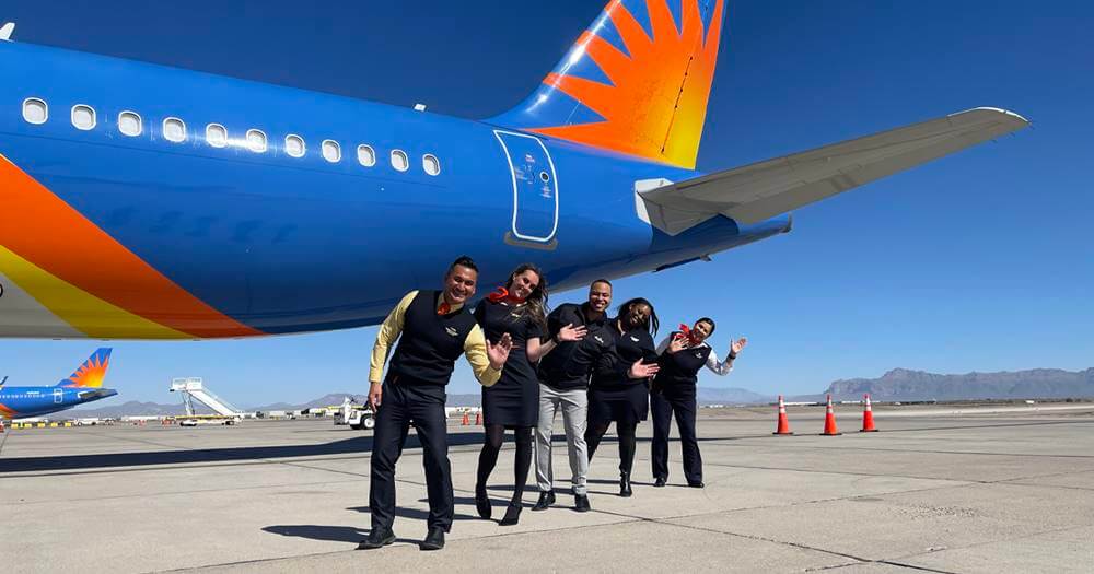 Allegiant Air male and female flight attendants tarmac