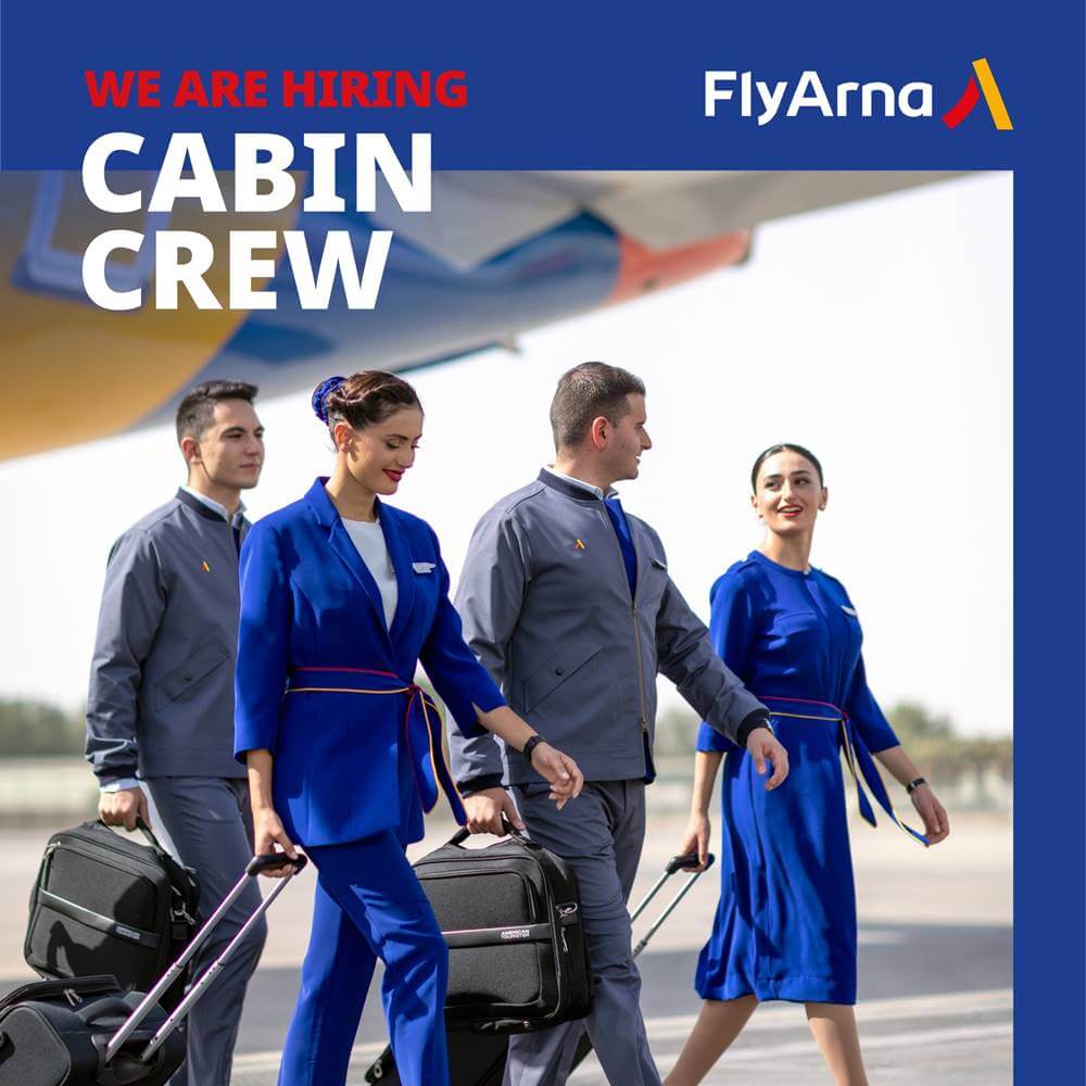 Fly Arna flight attendants walk