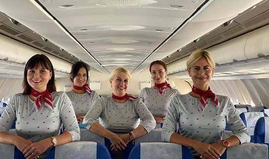 GullivAir flight attendants smile