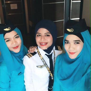 NAM Air female flight attendants and pilot
