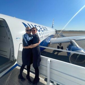Niceair flight attendants hug