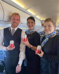 Niceair flight attendants with beer