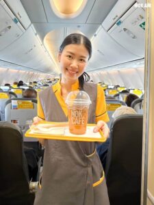 Nok Air flight attendant with Nok Cafe