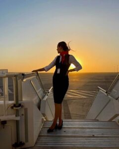 SmartLynx female flight attendant steps