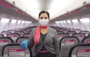 Swoop Airlines flight attendant boarding