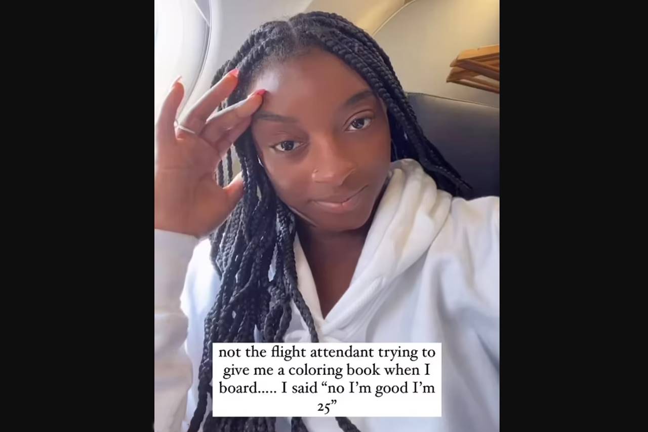 flight attendant gives simon biles gymnast coloring book child